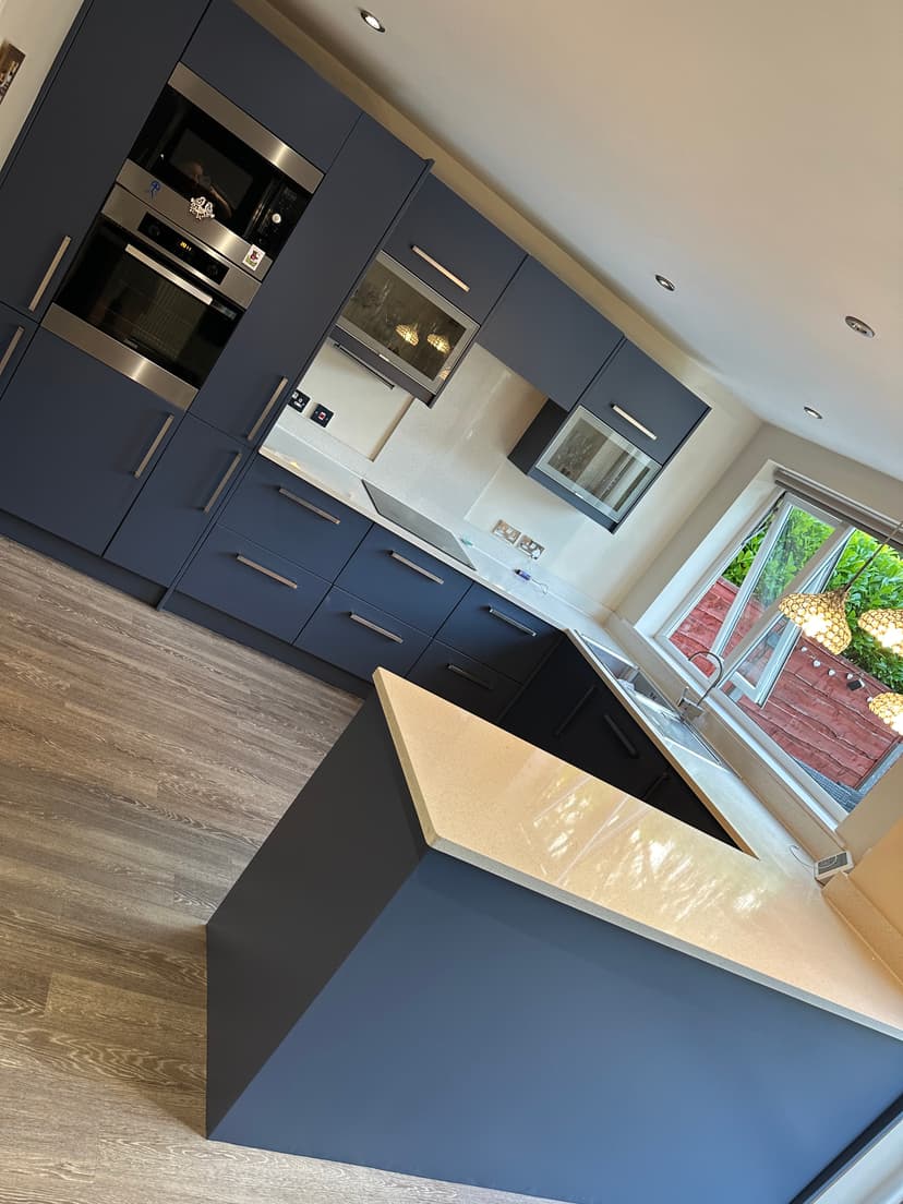Kitchen after respray - stunning navy blue with island in Urmston