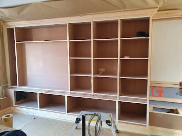 Built-in shelving before - bare MDF